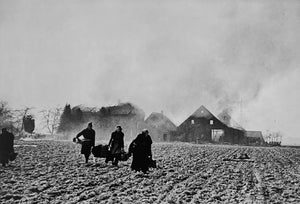 - Robert Capa - Germany, 1945. German Civilians leave their blasted farmhouse.