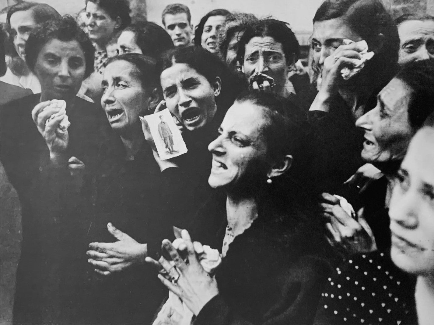 - Robert Capa - Italy, 1944. Grieving mothers of Napoli.